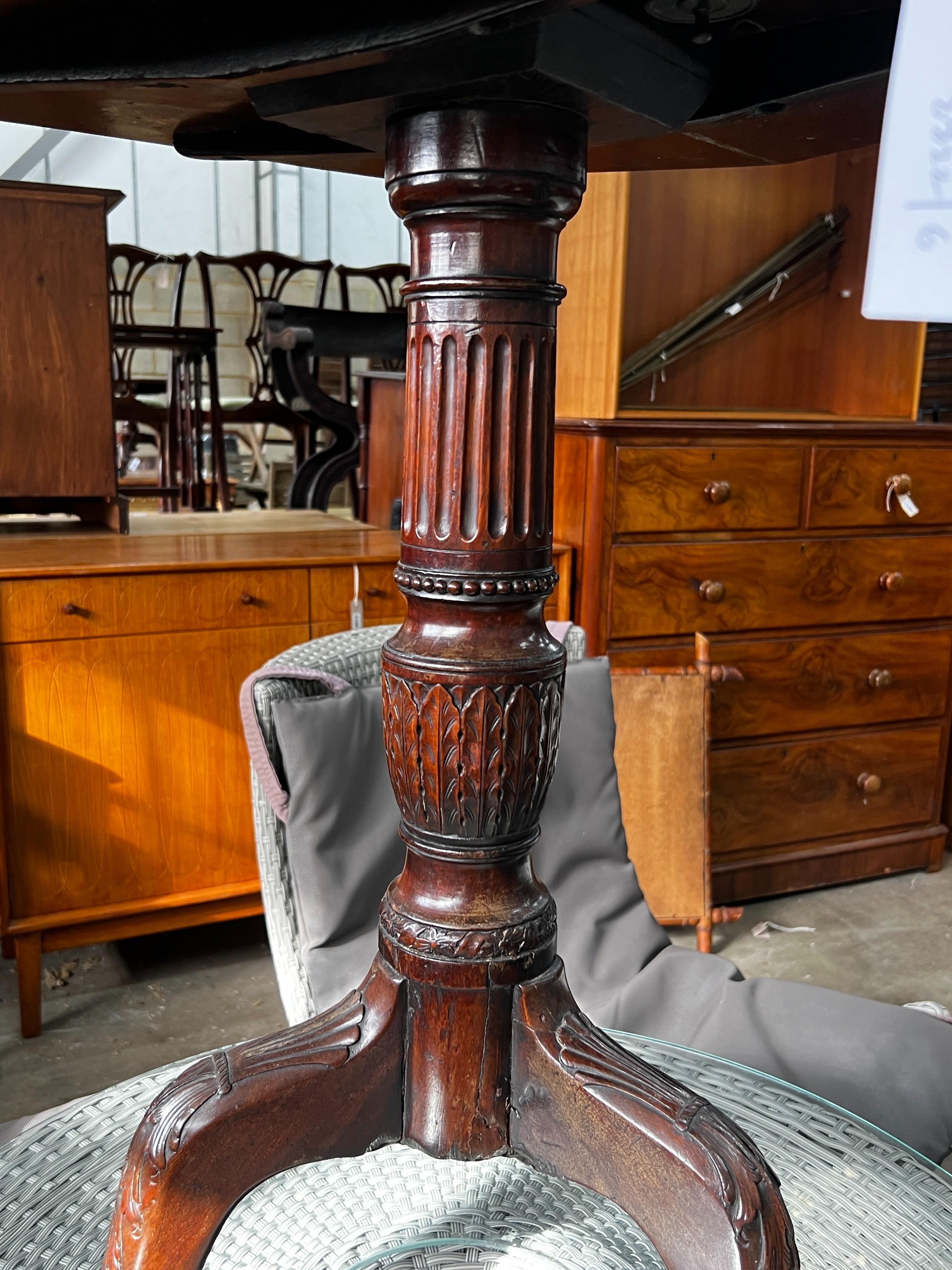 A George III and later octagonal mahogany tilt top tripod tea table, width 68cm, height 74cm
